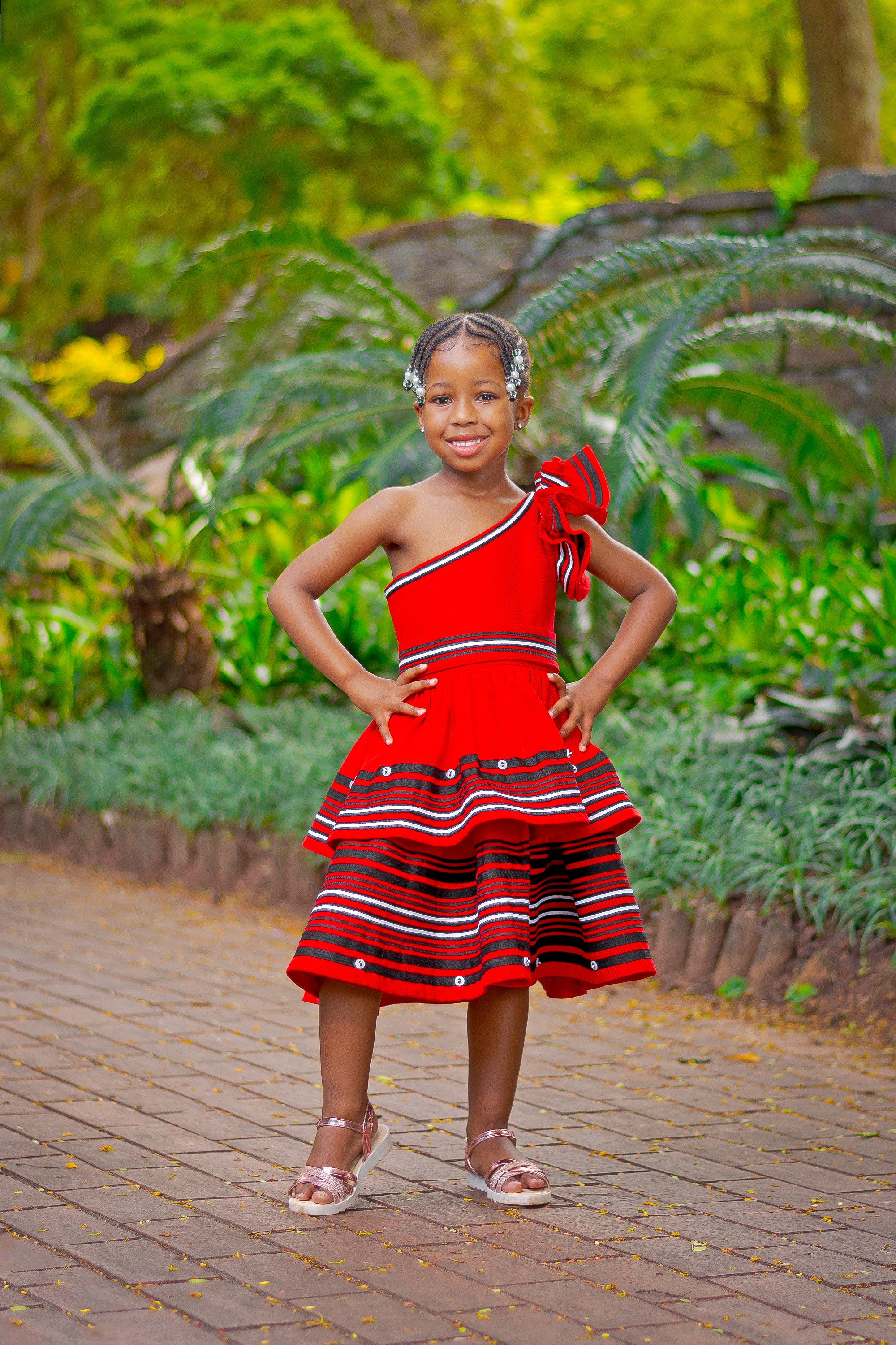 Red frilly one arm girls dress