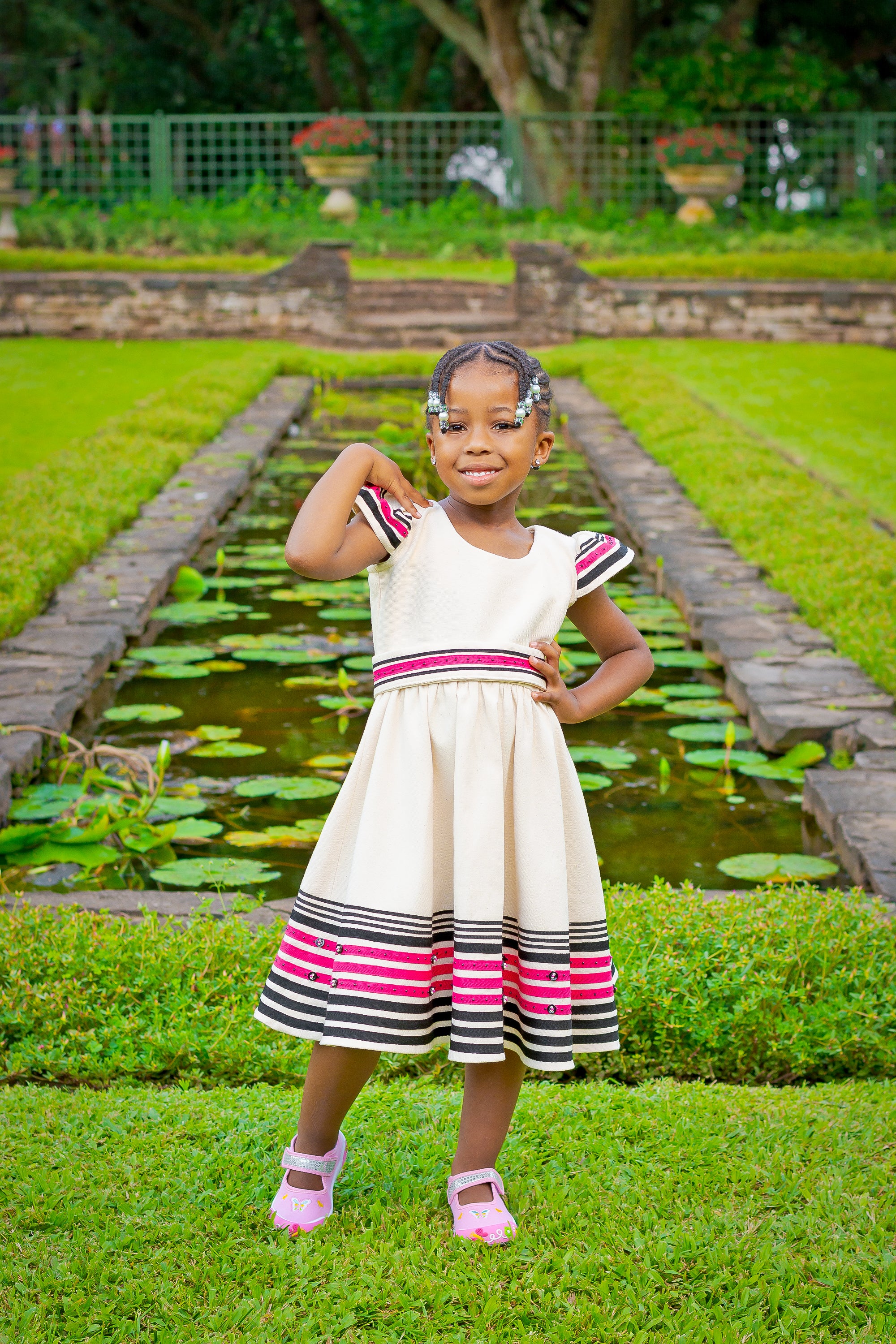 Cream, black and cerise pink girls dress