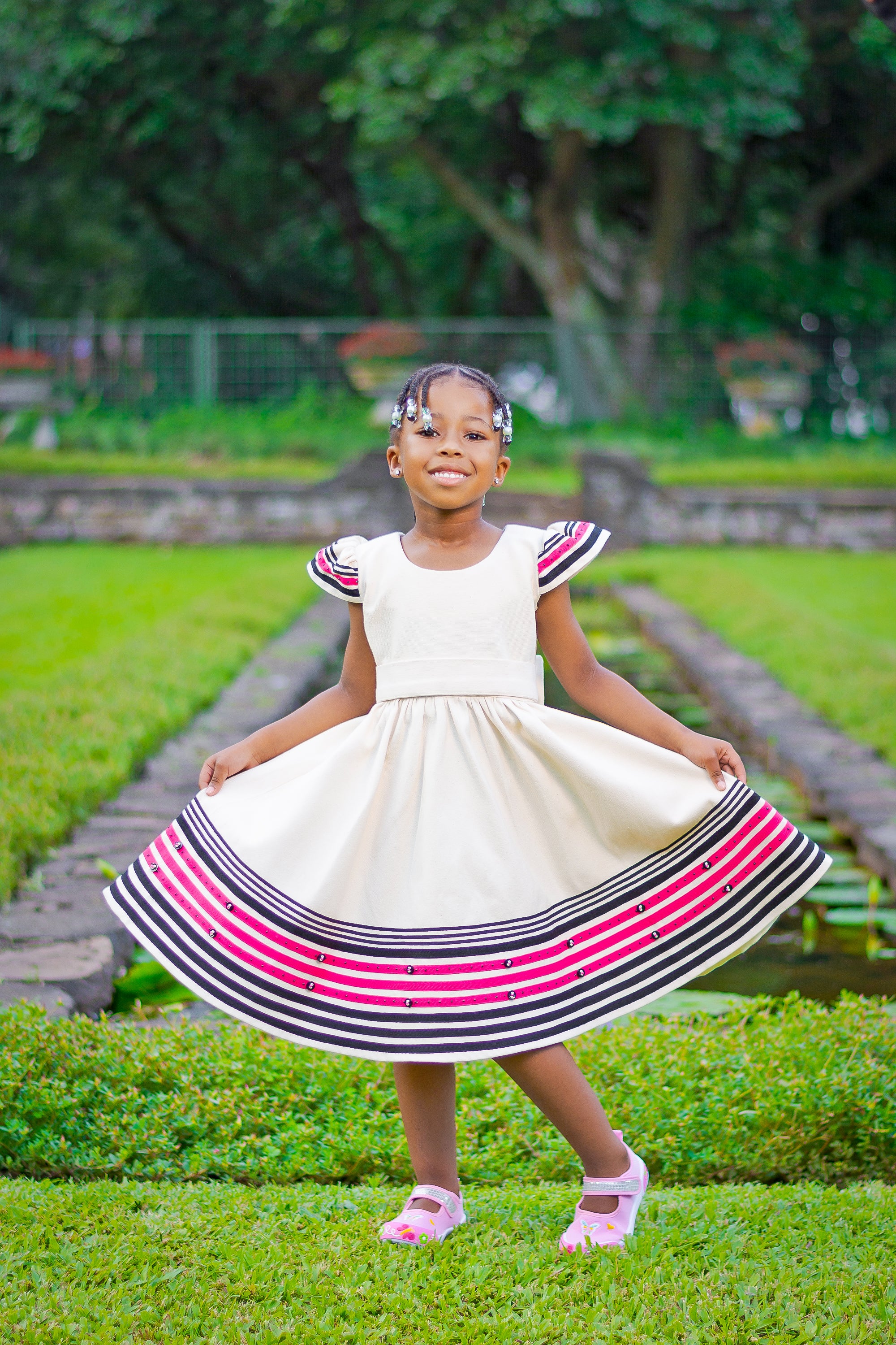 Cream, black and cerise pink girls dress