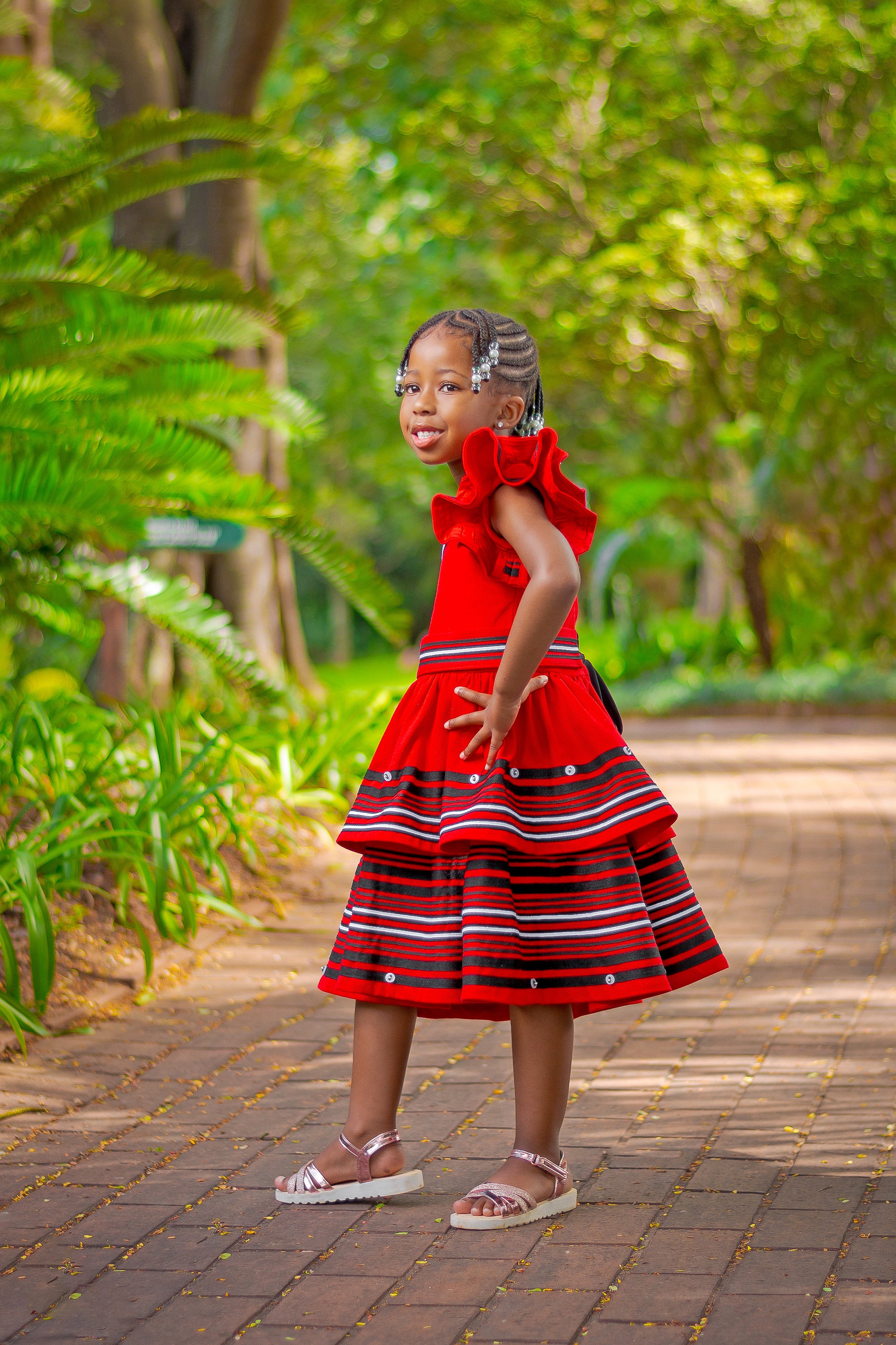 Red frilly one arm girls dress