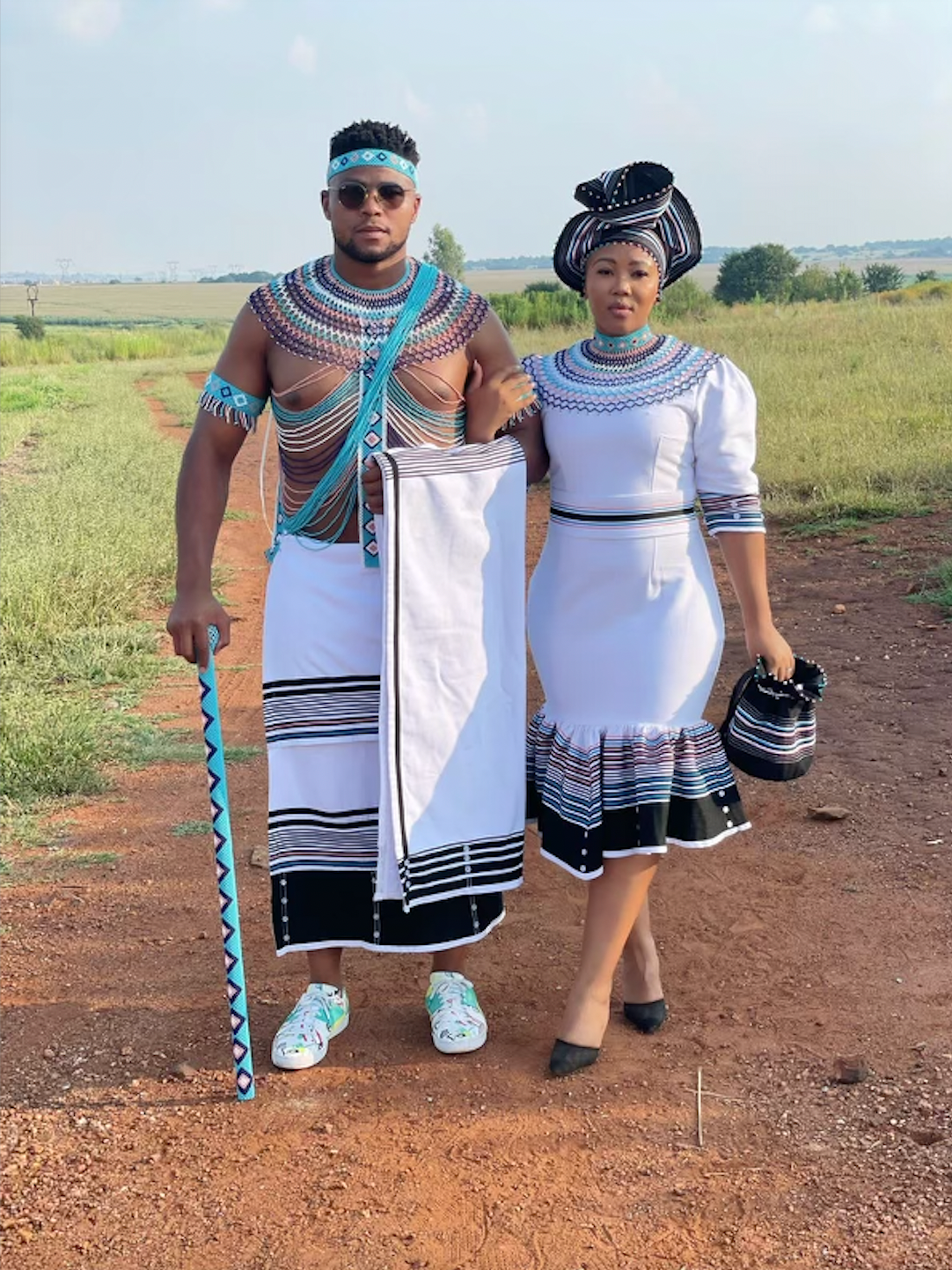White, black, pink and blue his and hers ensemble